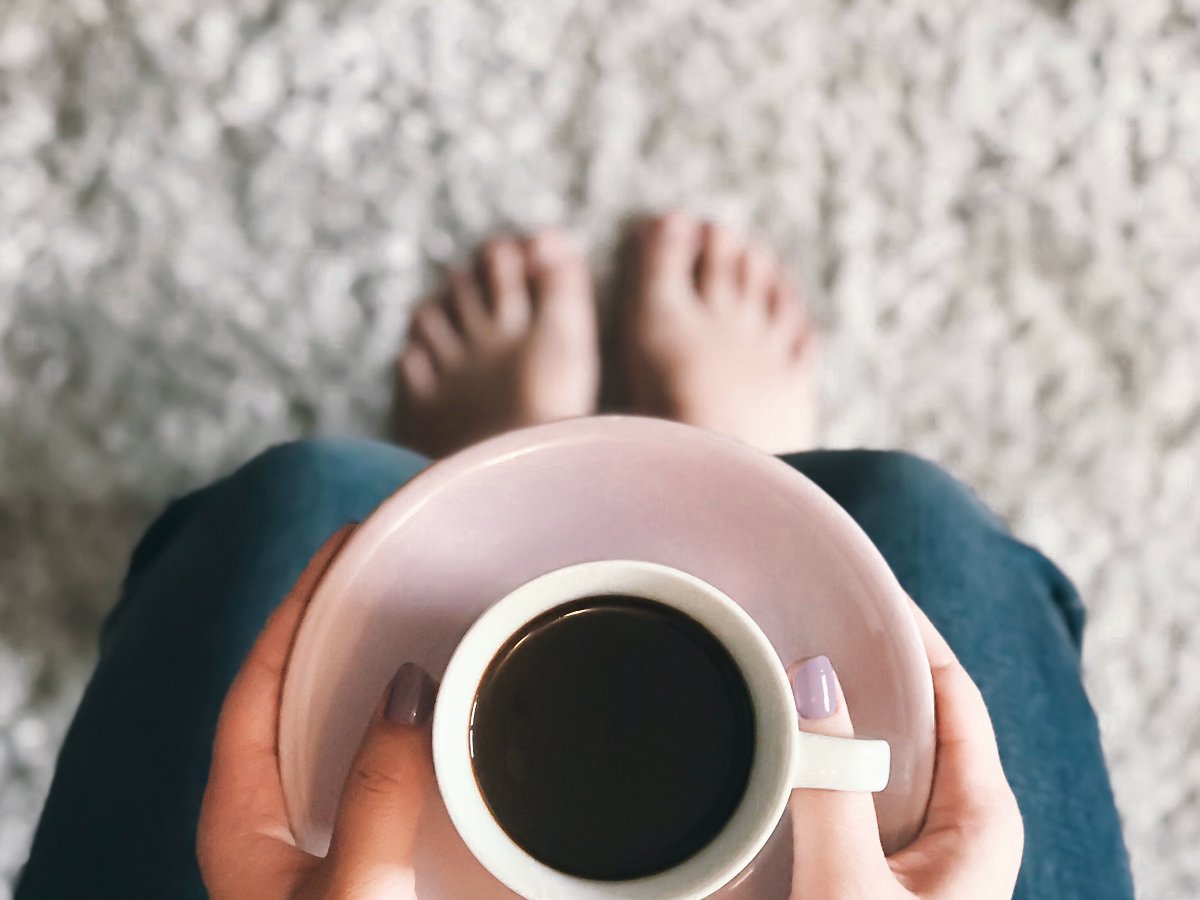 Drinking coffee on a soft carpeted floor