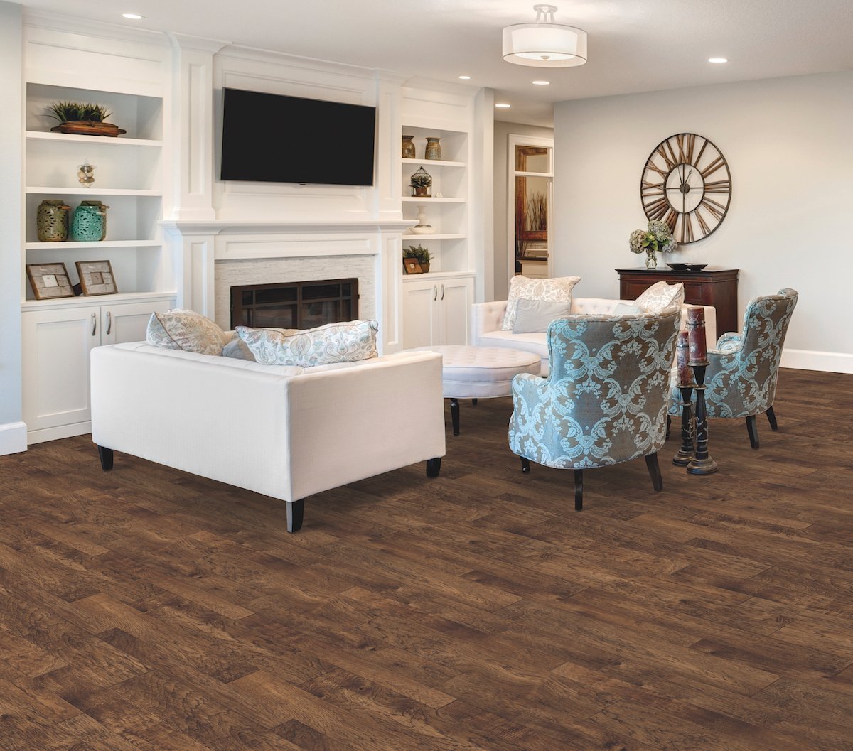 Living room with white sofas and accent chairs